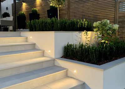 Stone landscaped terraces and steps with integrated lighting in Orpington
